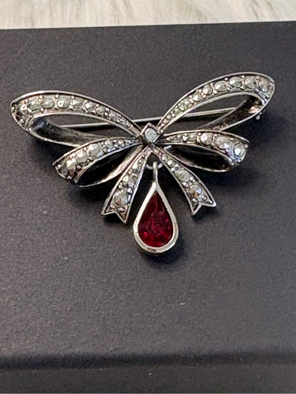 Avon Silver-Tone Bow Brooch with Red Teardrop